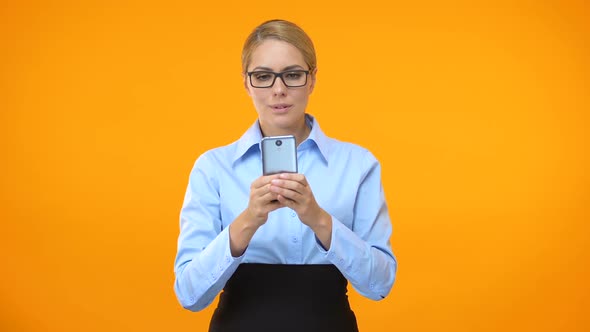 Happy Female Manager Typing Message on Smartphone, Social Networks, Business App