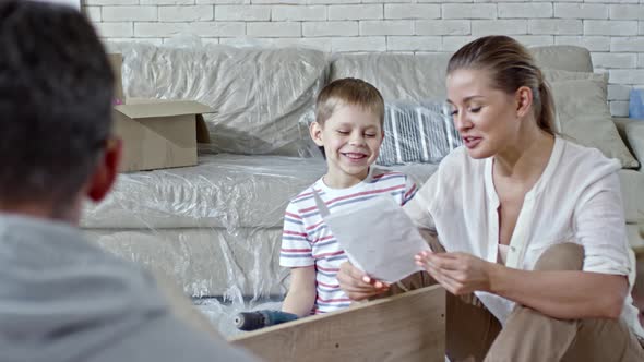 Cheerful Family Assembling Furniture alt