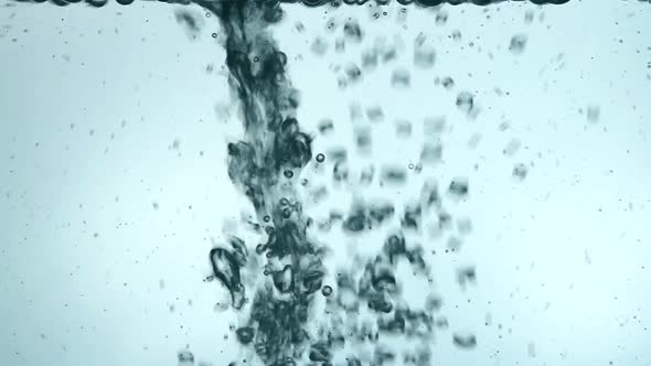 Pouring water in drinking glass