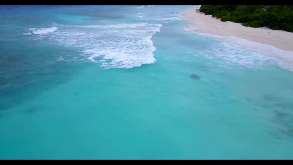 Aerial top view panorama of relaxing tourist beach vacation by turquoise sea with white sand backgro