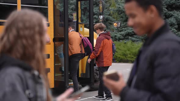 School Bus Picking Up Students After Studies
