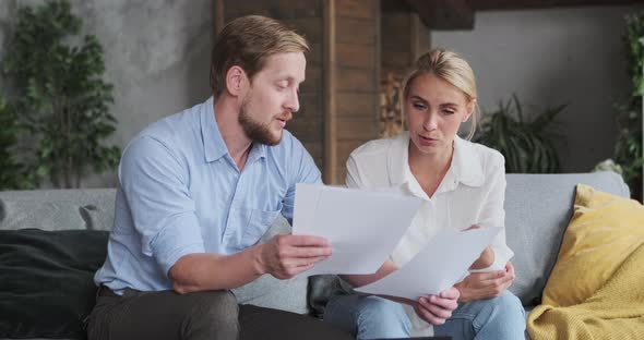 Woman Realtor and Male Client Discussing Paper Document Agreement House Rent or Buying Real Estate