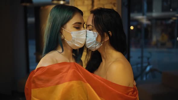 Two Naked Lesbian Women in Medical Masks with Rainbow Flag