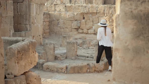 Woman Doing Archeological Researches at Ancient Temple