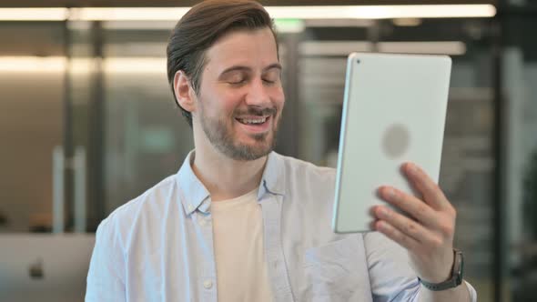 Portrait of Video Chat on Tablet By Man