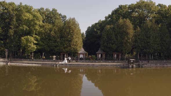 Lovely Newlyweds Caucasian Bride Groom Walking in Park Holding Hands Wedding Couple Family