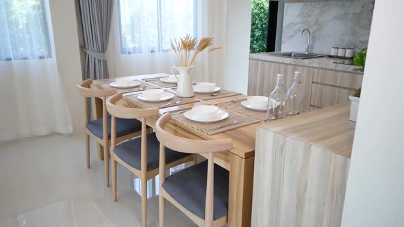 Minimal and Stylish Decorative Dining Area With Wooden Table and Chairs