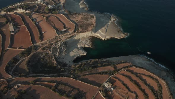 St Peter's Pool Famous Tourist Spot on Malta Island with Tourism in Sunset Summer Light, Aerial Wide