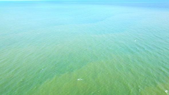 4K Aerial view of drone move on beautiful sea. Flight over ocean, open sea.