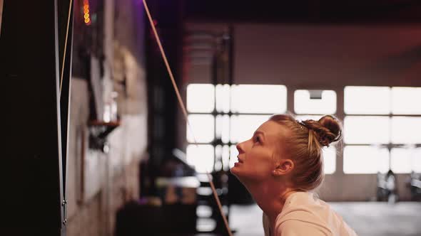 Determined Female Athlete Doing Workout In Gym