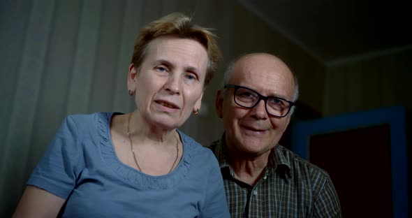 Aged Married Couple Is Communicating By Video Call, Looking at Camera, Portrait