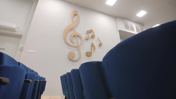 Decorative Music Notes on Wall and Chairs in Concert Hall