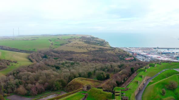 Drone shot over dover castle towards white cliffs and port