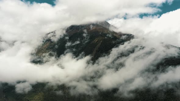 Panorama Of Tungurahua Stratovolcano Covered With Clouds From Baños In Ecuador. - wide