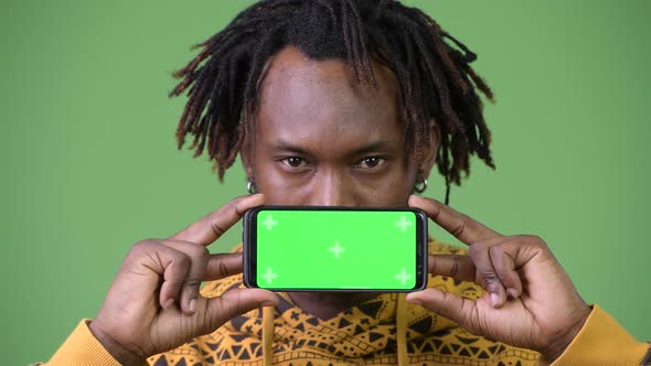 Young Handsome African Man Showing Phone