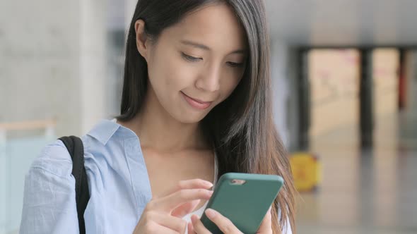 Woman Looking at Mobile Phone 