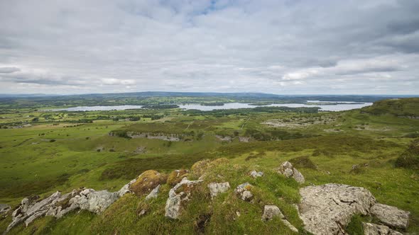 Time lapse of rural and remote landscape of grass, trees and rocks during the day in hills of Carrow alt