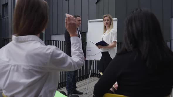 Positive Young Female Manager Thanking Man for Report Inviting Woman As Spokesperson