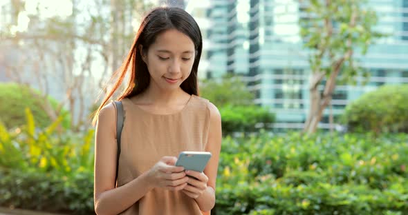 Woman use of smart phone in the evening 