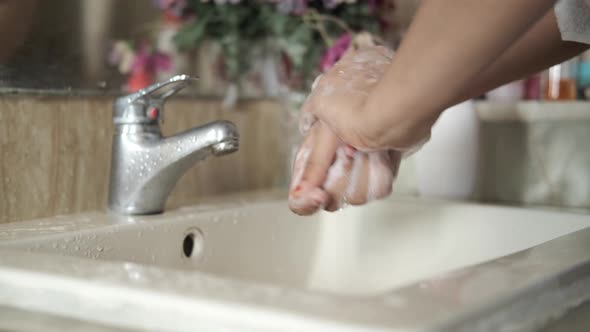 Women Washing Hands with Soap Warm Water