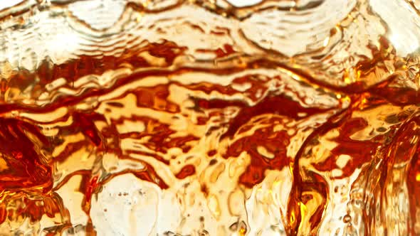 Super Slow Motion Shot of Ice Tea Splash Isolated on White Background at 1000Fps