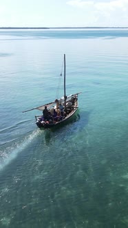 Boat Boats in the Ocean Near the Coast of Zanzibar Tanzania Slow Motion Vertical Video