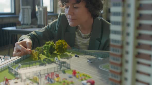 Female Architect Working on Model for Real Estate