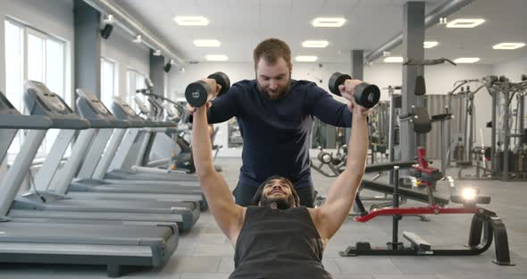 Pakistani Guy Training with Coach at Gym