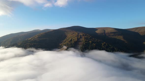 Aerial View of Autumn Carpathian Mountains Above the Clouds