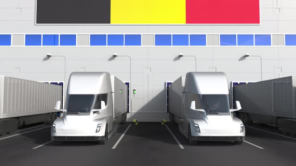 Trailer Trucks at Warehouse Loading Dock with Flag of BELGIUM