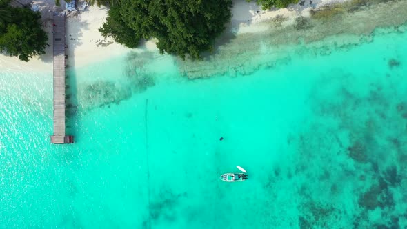 Aerial view travel of luxury coast beach break by blue green water with white sandy background of a 