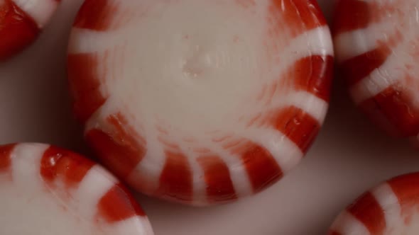 Rotating shot of peppermint candies - CANDY PEPPERMINT 024