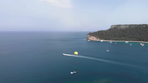 Parasailing over tropical island.