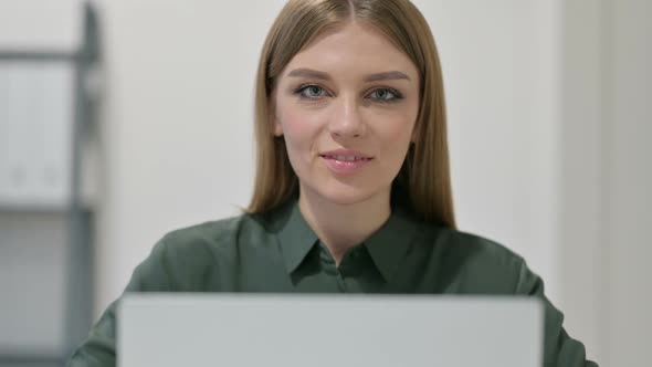 Thumbs Up By Woman with Laptop