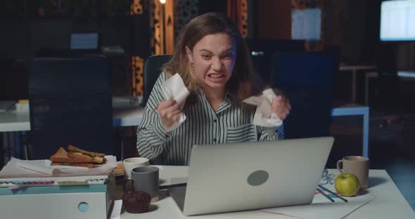 Angry Businesswoman Screaming and Crumpling Paper While Working on Laptop, Stressed Girl Finding