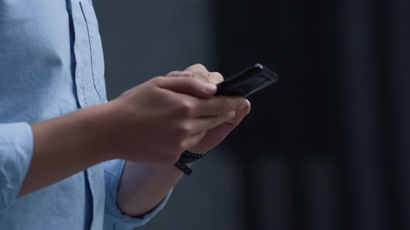 Man Hands Swiping Smartphone with Finger Close Up