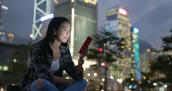 Woman use of mobile phone at outdoor