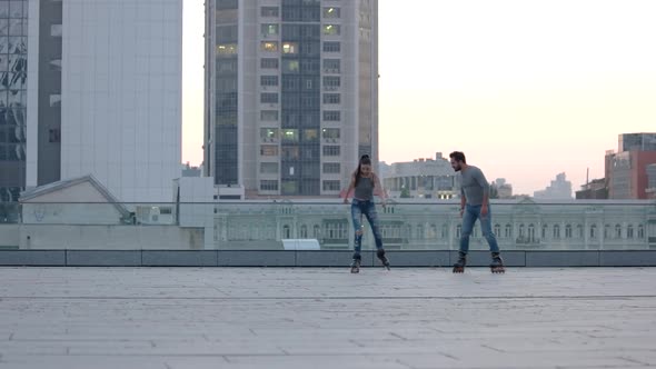 Couple on Rollerblades in City