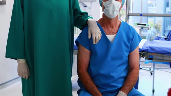 Portrait of surgeons wearing surgical mask in operation theater