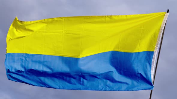 Ukrainian Flag Waving Against Grey Sky Slow Motion Waving in the Wind Dark Clouds Conflict War with