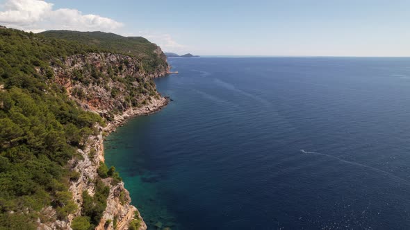Aerial view of the Pasjaca cliff and beach, blue sea and mountains, Croatia