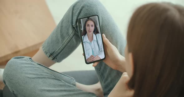 Female Using Online Chat To Talk with Family Therapist and Checks Possible Symptoms During Pandemic