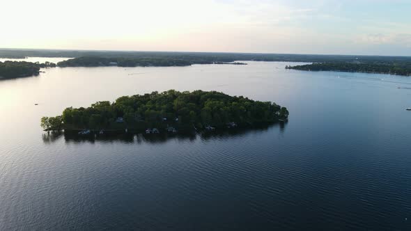 aerial video of lonely island found in  Lake Minnetonka, Minnesota during summer time