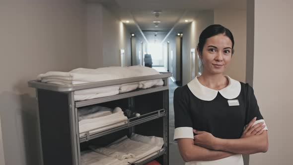 Portrait of Pretty Female Housekeeper in Hotel