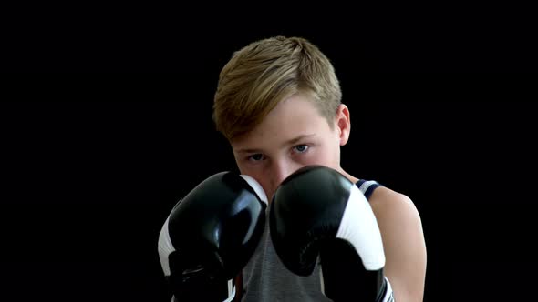 A Young Sportsman Is Engaged in Boxing