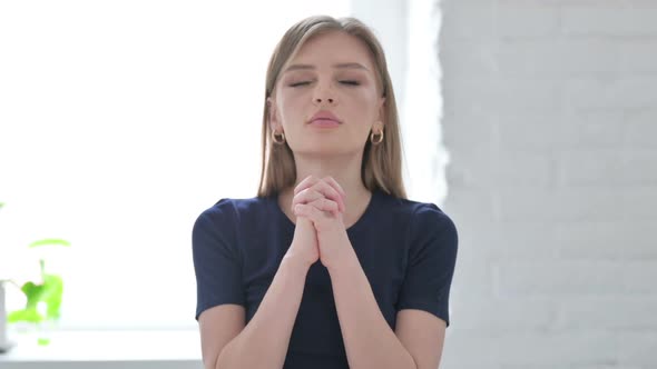 Man Praying to God with Closed Hands