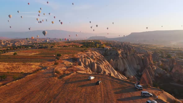 Scenic Landscape With Air Balloons In The Sky