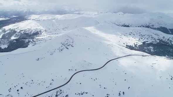 Storm brewing over the peaks on Loveland Pass, Colorado. Aerial views of mountains and highway 6.