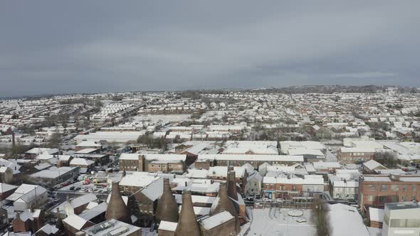 Aerial view of the famous bottle kilns at Gladstone Pottery Museum, covered in snow on a cold winter