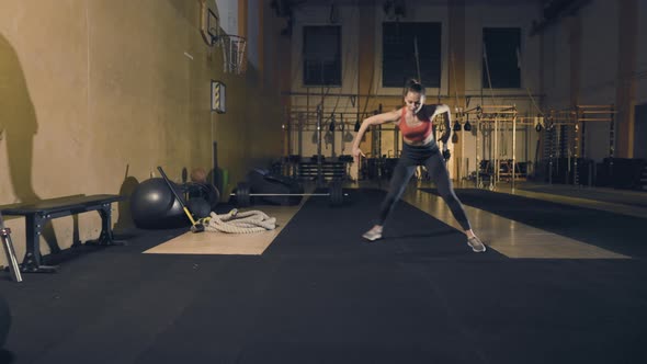 Young Woman Doing Ice Skater Exercise